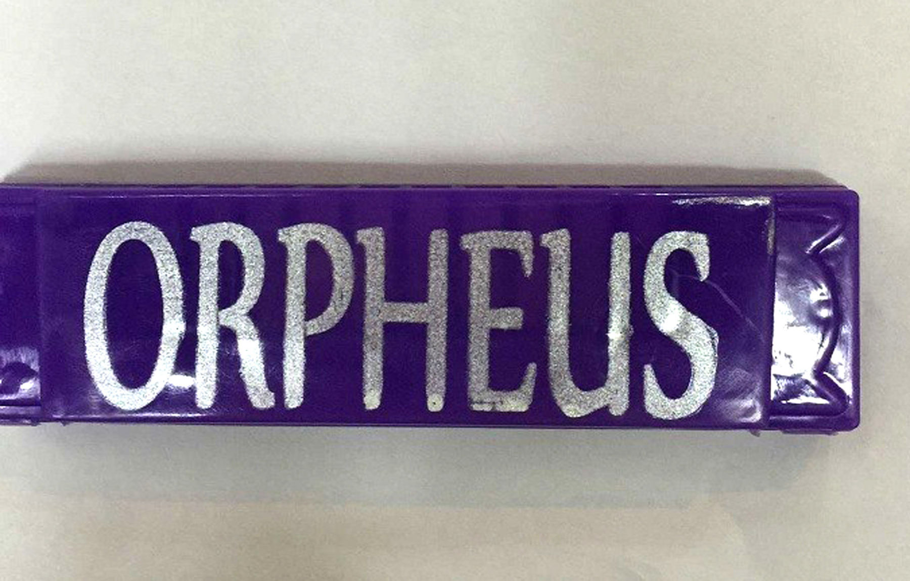 Krewe of Orpheus throws: fedoras, footballs and musical instruments galore